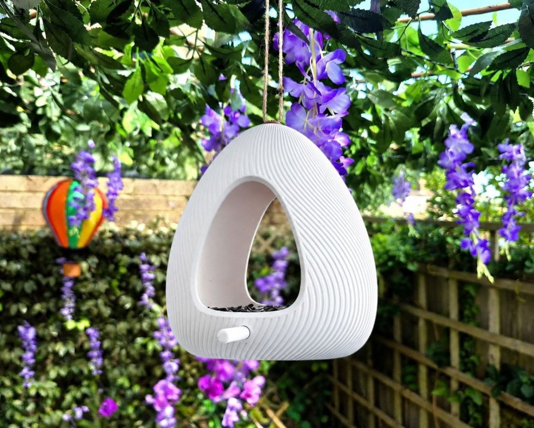 Modern Bird Feeder hanging in a garden